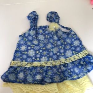 Blue floral tank with yellow shorts